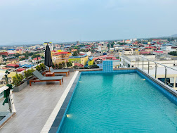 9th-floor rooftop infinity pool overlooking Kampot — sister hotel next to Khemra Guesthouse